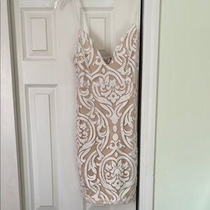 White knee-length bodycon dress with plunging neckline for cocktail